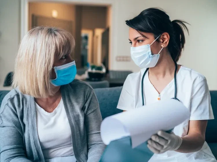 Doctor and patient in surgical masks