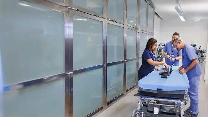 Physicians looking at medical device